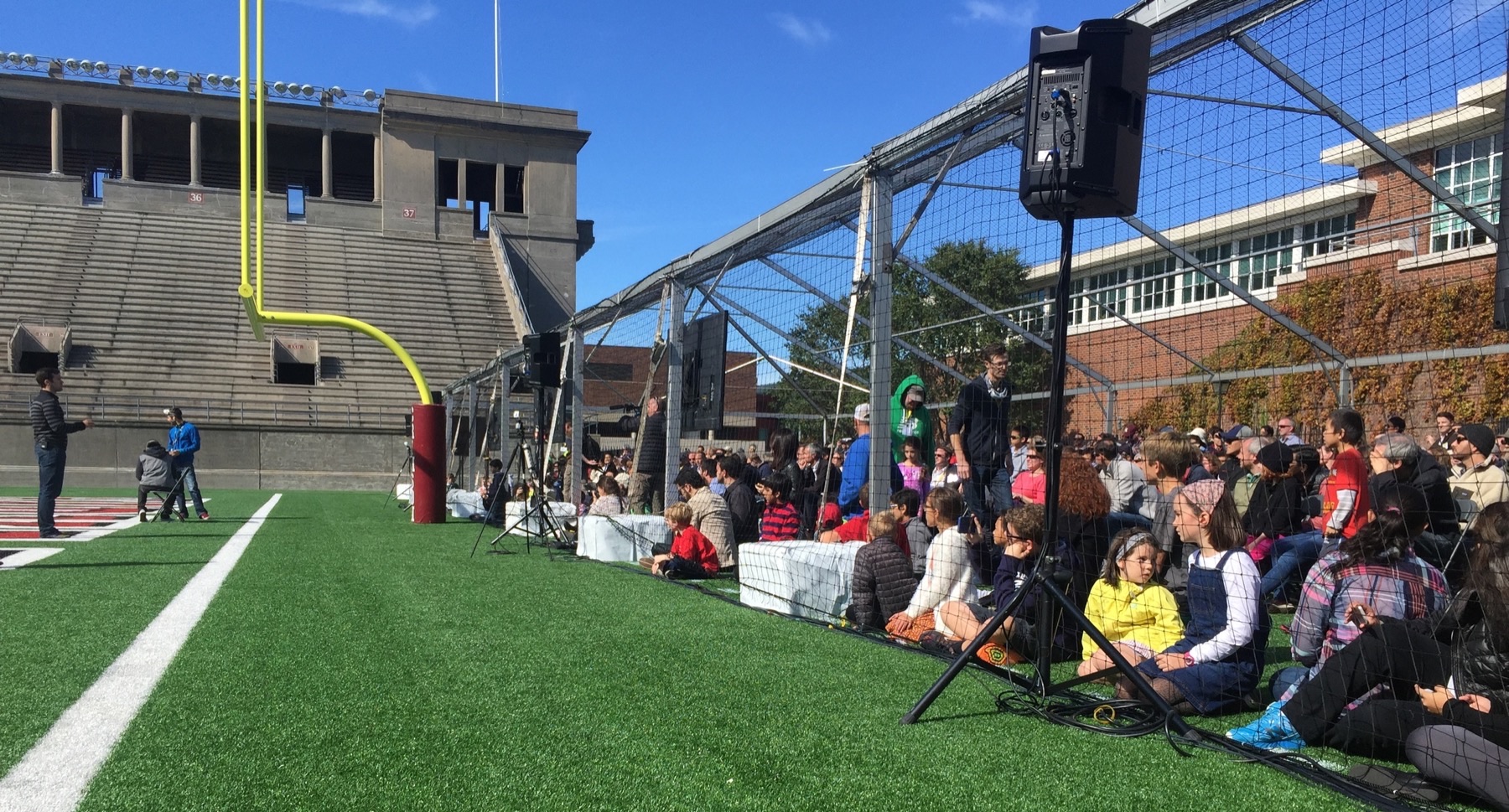  Spectators wait behind safety netting to watch the Drone Racing League 