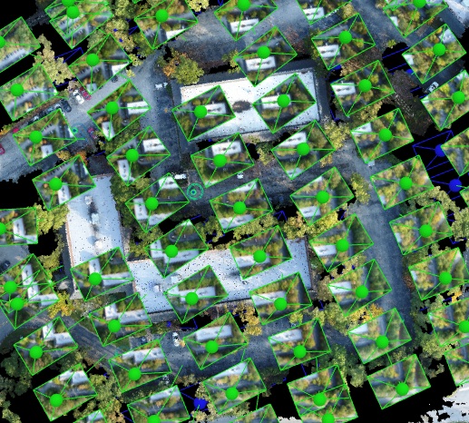 Photogrammetry processing view showing aligned camera positions across a site.