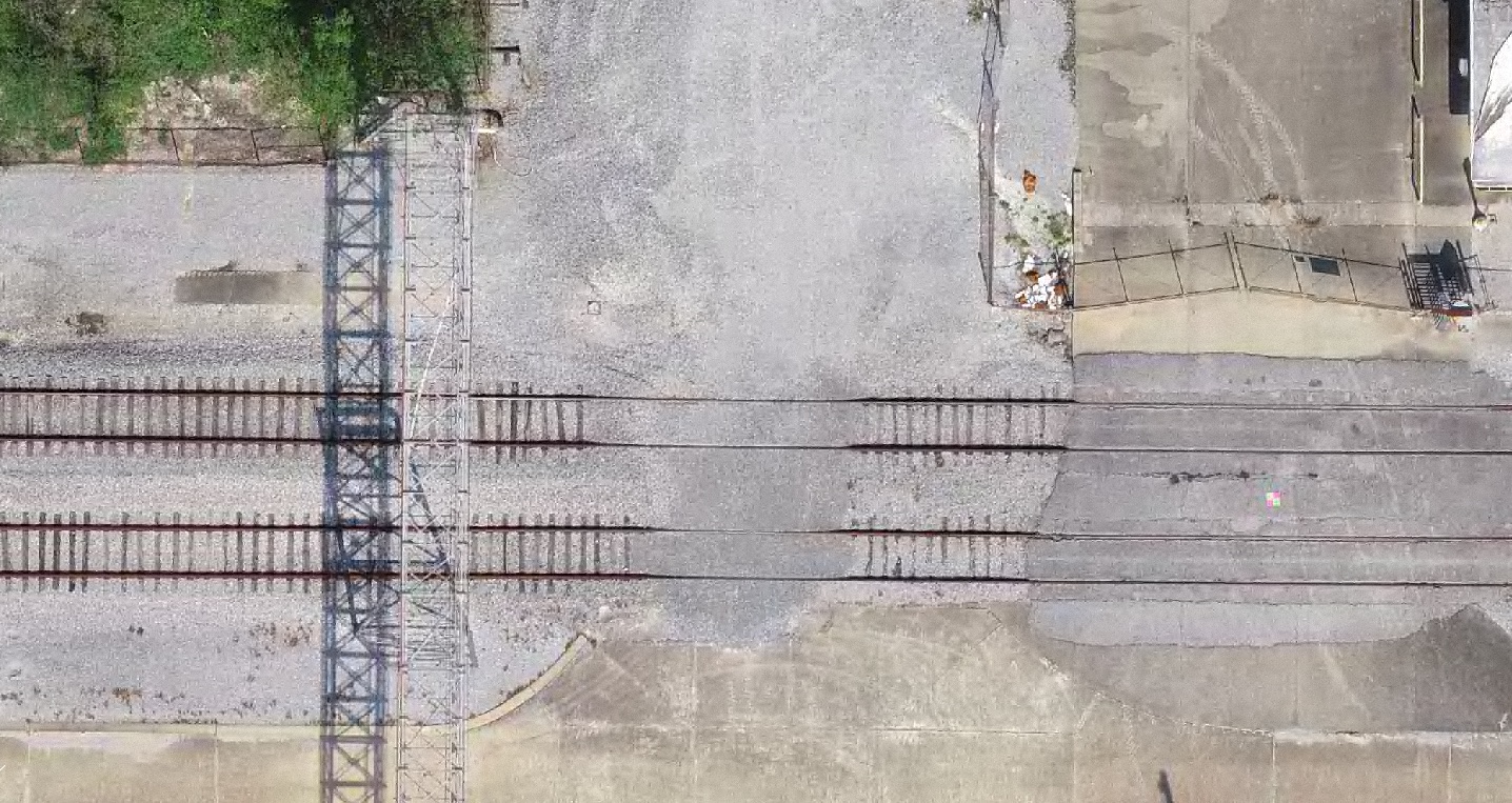 Orthophoto showing linear site features clearly visible from above.